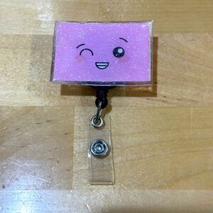 Winky face badge reel